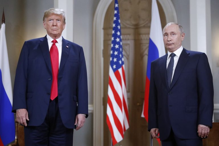 U.S. President Donald Trump, left, and Russian President Vladimir Putin pose for a photograph at the beginning of a one-on-one meeting at the Presidential Palace in Helsinki, Finland, Monday, July 16, 2018. (Pablo Martinez Monsivais/AP Photo)