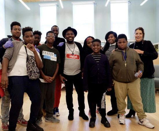 Some of Logan Library's teen regulars with Fred Ginyard (center in hat) and Lynne Haase (at right) during the library's 100th birthday bash (Ashley Hahn for PlanPhilly)
