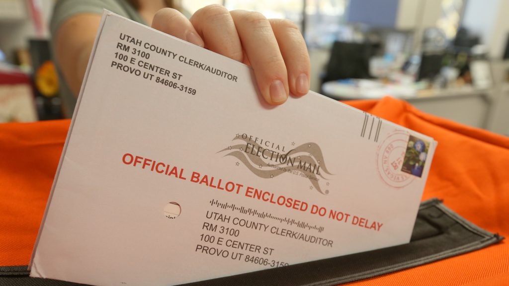An employee at the Utah County Election office puts mail in ballots into a container to register the vote in the midterm elections on November 6. An employee at the Utah County Election office puts mail in ballots into a container to register the vote in the midterm elections on November 6.
(George Frey/Getty Images)