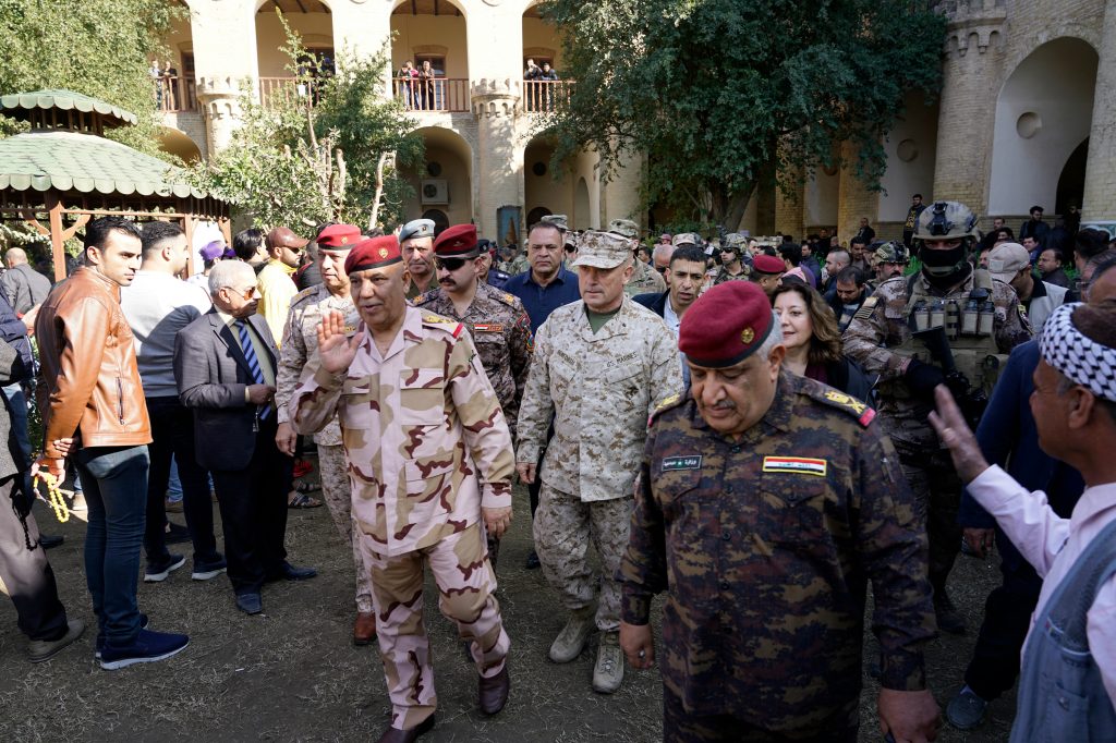 U.S. Marine Brig. Gen. Austin Renforth (center) went with his Iraqi counterpart, Lt. Gen. Jalil Jabbar al-Rubaie (center left), for a tour of Baghdad’s most crowded neighborhoods on Friday. U.S. Marine Brig. Gen. Austin Renforth (center) went with his Iraqi counterpart, Lt. Gen. Jalil Jabbar al-Rubaie (center left), for a tour of Baghdad's most crowded neighborhoods on Friday.
(Mootaz Sami/AP Images for NPR)