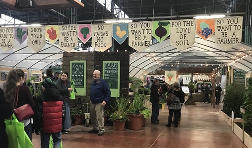 An exhibit at the Farm Show aimed at getting non-farmers interested in joining the industry. (Katie Meyer/WITF)