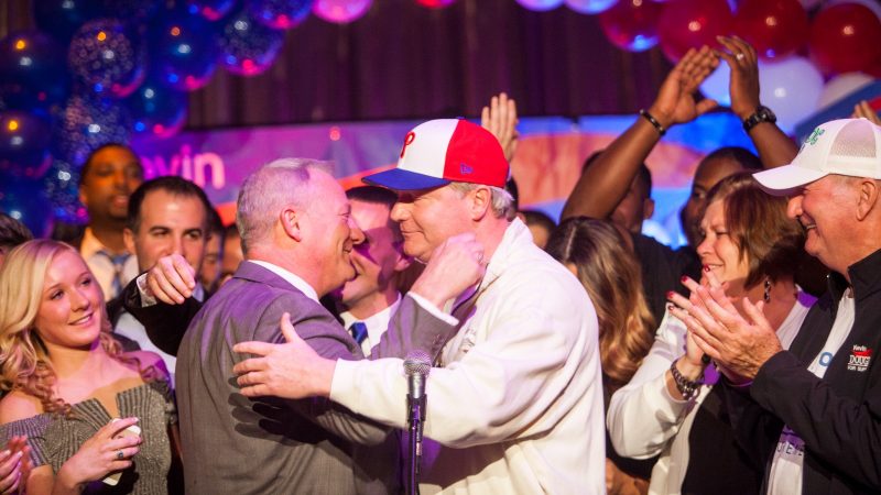 Pennsylvania Supreme Court Judge Elect Kevin Dougherty (left) hugs his brother John Dougherty at a post-election party at the Stagehands Union Hall in South Philadelphia. (Brad Larrison for WHYY)