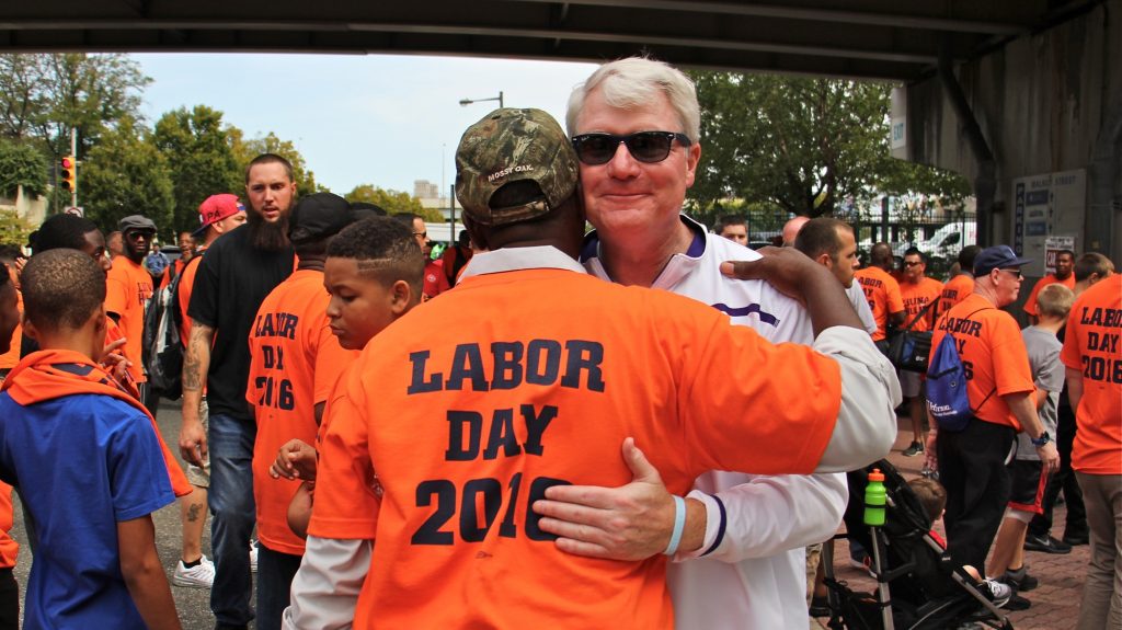2016 09 05-e lee-john dougherty-penns landing-labor day parade Labor leader John Dougherty embraces a union member during the Labor Day parade in Philadelphia on Sept. 5, 2016. (Emma Lee/WHYY)