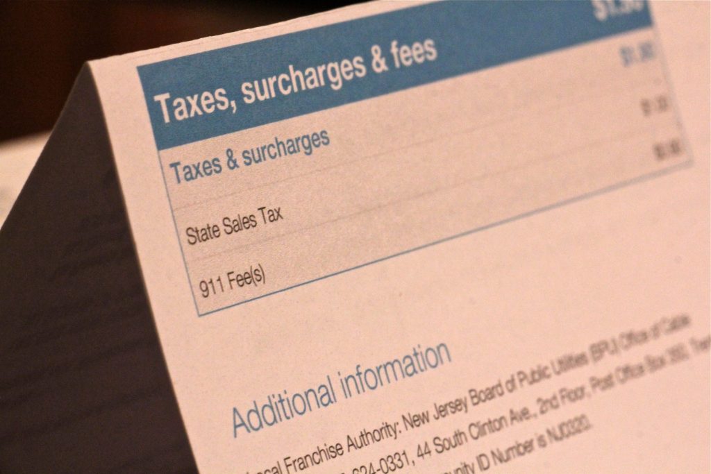 A New Jersey phone bill shows a 90 cent 911 fee. (Emma Lee/WHYY