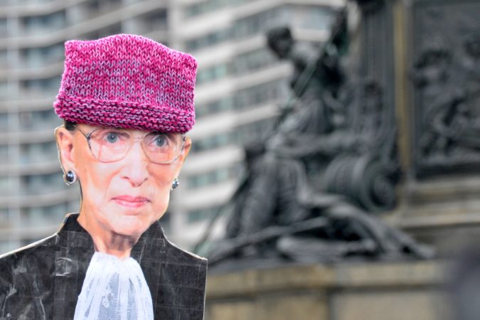 A cardboard cutout of Supreme Court Justice Ruth Bader Ginsburg is held up by a participant during the 2019 Women's March, at Eakins Oval, in Philadelphia, Pa. (Bastiaan Slabbers for WHYY)