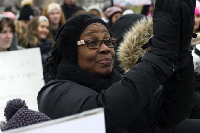 The audience listens to speakers on stage during the 2019 Women's March on the Benjamin Franklin Parkway, in Philadelphia, Pa. (Bastiaan Slabbers for WHYY)