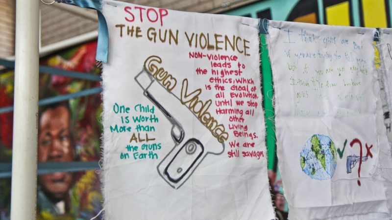 Participants at the MLK Day of Service at Girard College create banners. (Kimberly Paynter/WHYY)