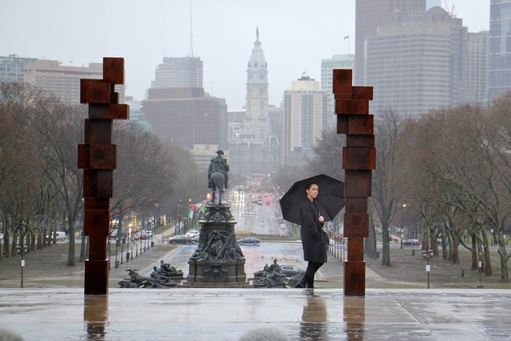 2019 01 24-e lee-anthony gormley-philadelphia art museum-sculpture installation blockworks stand A visitor to the Philadelphia Museum of Art inspects the sculpture series,