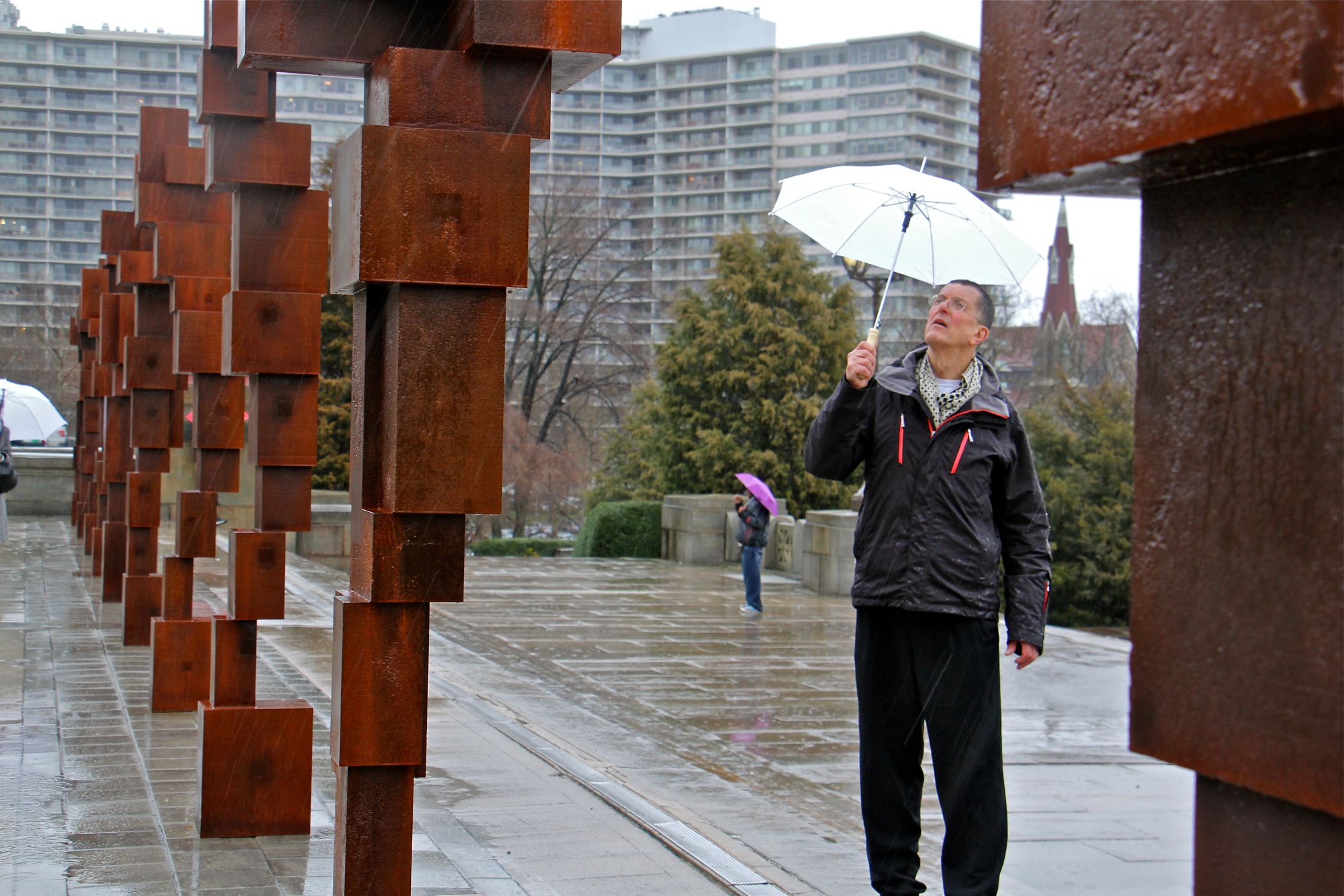 Anthony Gormley walks among his "Blockworks" sculptures on the upper terrace of the Philadelphia Museum of Art.