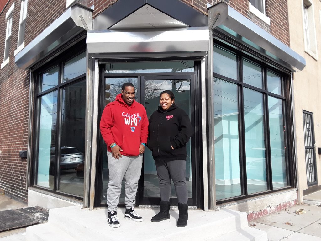 20190110_115040 Al Harris, left, and Marjani 'MJ' Harris, right, stand outside the new CancerWho? community center in the Port Richmond neighborhood. (Trenae Nuri/WHYY News)