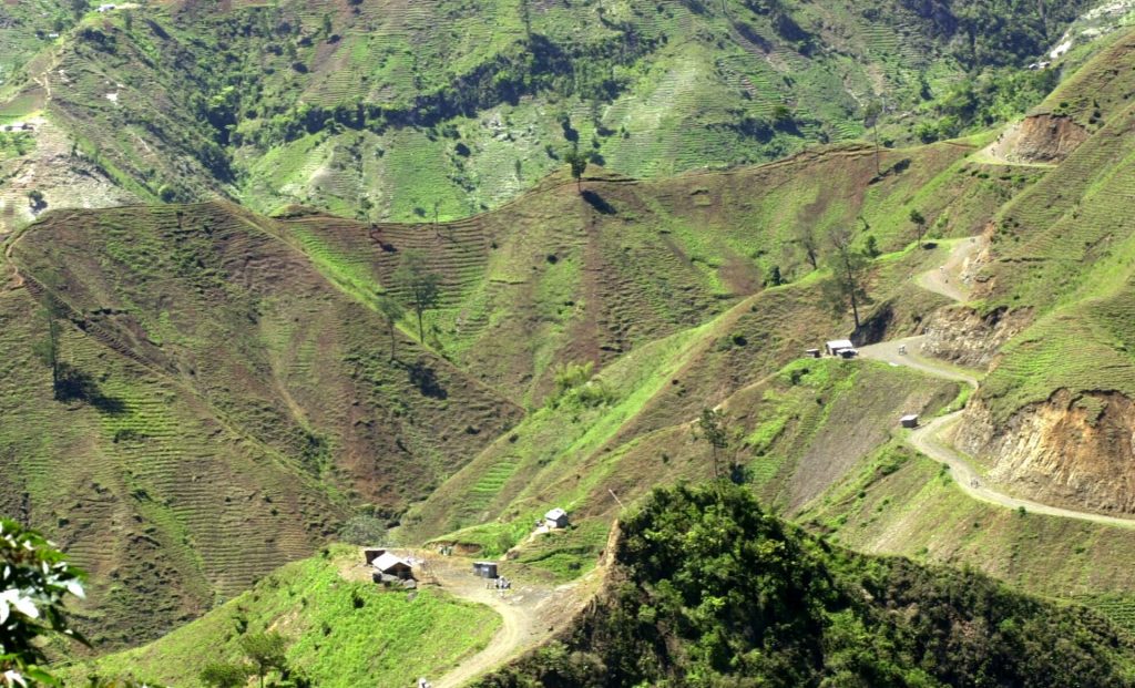 AP_03060506849-1920×1165 The denuded slopes of Massif de la Selle mountain range in Haiti above Jacmel, are seen Thursday June 5, 2003. Once covered with pine, cedar and juniper trees, the slopes are on their way to complete deforestation as farmers cut down trees and plant vegetables in the fragile topsoil. (Daniel Morel/AP Photo)
