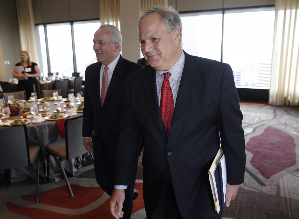 Jack Gerard, David Bernhardt, r m U.S. Deputy Secretary of the Interior David Bernhardt, foreground, and Jack Gerard, American Petroleum Institute president and chief executive officer, head up to speak during the annual state of Colorado energy luncheon sponsored by the Colorado Petroleum council Thursday, July 26, 2018, in Denver. (David Zalubowski/AP Photo)