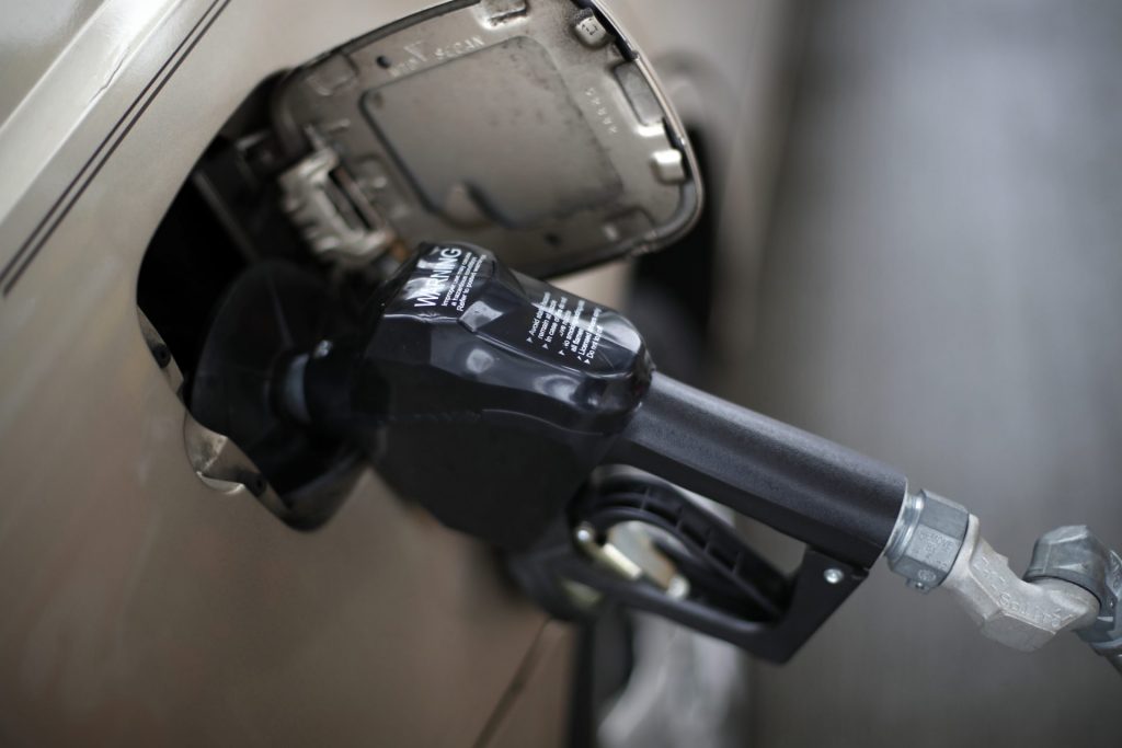 In this Nov. 16, 2018, file photo, a gas pump nozzle fills up gas in a car at a pump in West Mifflin, Pa. (Gene J. Puska /The Associated Press)