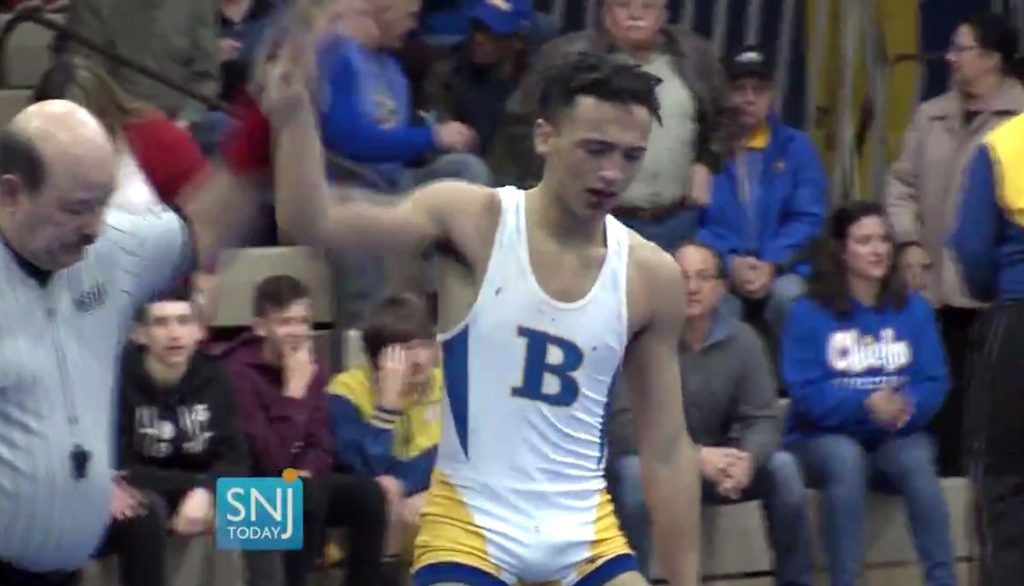 High School Wrestler Dreadlocks Cut In this image taken from a Wednesday, Dec. 19, 2018 video provided by SNJTODAY.COM, Buena Regional High School wrestler Andrew Johnson is declared the winner after his match in in Buena, N.J. Before the match a referee told Johnson he would forfeit his bout if he didn't have his dreadlocks cut off. Johnson had his hair cut minutes before the match and a SNJ Today reporter tweeted video of the incident. The state's Interscholastic Athletic Association says they are recommending the referee not be assigned to any event until the matter has been reviewed more thoroughly. (Michael Frankel/SNJTODAY.COM viavAP)