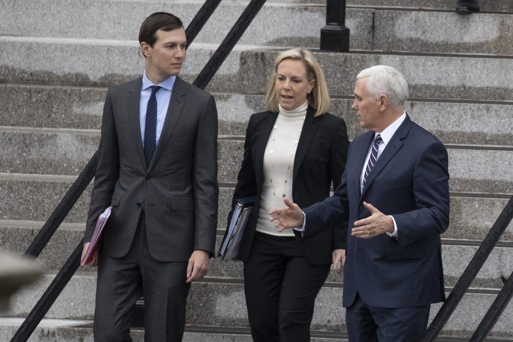 White House Senior Adviser Jared Kushner, (left), Homeland Security Secretary Kirstjen Nielsen, and Vice President Mike Pence, talk as they walk down the steps of the Eisenhower Executive Office Building on the White House complex, Saturday, Jan. 5, 2019, in Washington. (Alex Brandon/AP Photo)
