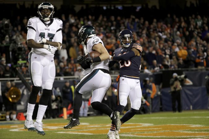 Philadelphia Eagles wide receiver Alshon Jeffery (17) celebrates as tight end Dallas Goedert makes a touchdown catch during the second half of an NFL wild-card playoff football game against the Chicago Bears Sunday, Jan. 6, 2019, in Chicago. At right is Chicago Bears safety Deon Bush. (AP Photo/Nam Y. Huh)