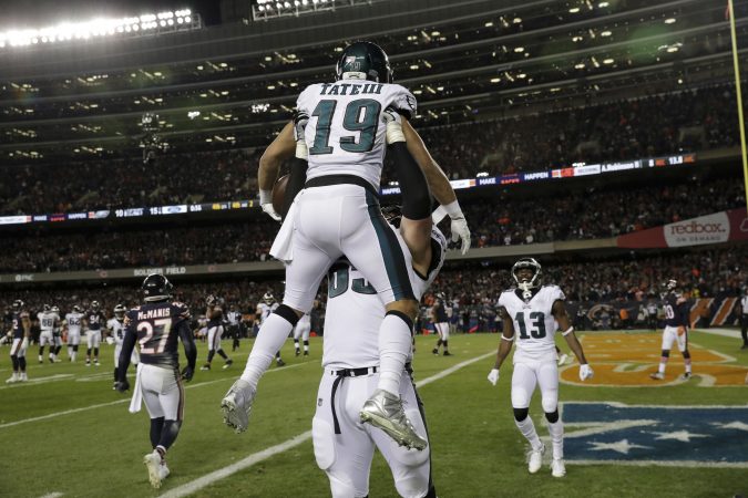 Philadelphia Eagles wide receiver Golden Tate (19) celebrates his touchdown reception with offensive tackle Lane Johnson (65) during the second half of an NFL wild-card playoff football game against the Chicago Bears Sunday, Jan. 6, 2019, in Chicago. (AP Photo/Nam Y. Huh)