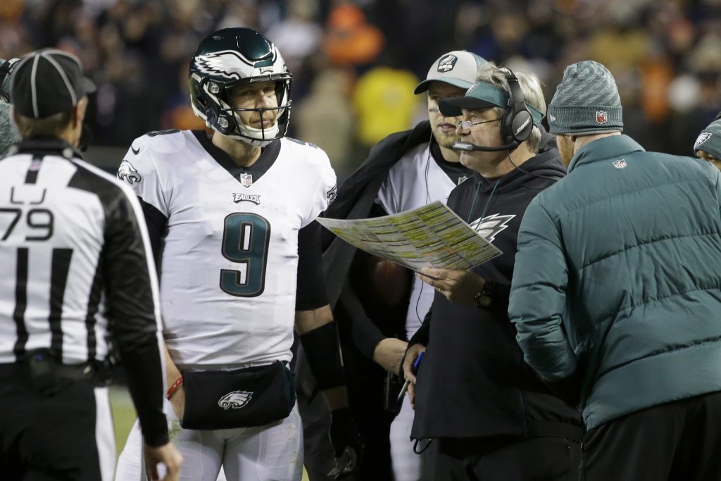 Eagles Bears Football Philadelphia Eagles quarterback Nick Foles (9) talks to head coach Doug Pederson during the second half of an NFL wild-card playoff football game against the Chicago Bears Sunday, Jan. 6, 2019, in Chicago. (AP Photo/David Banks)