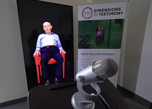 A Dimensions in Testimony exhibit featuring Holocaust survivor William Morgan using an interactive virtual conversation is shown at the the Holocaust Museum Houston Friday, Jan. 11, 2019, in Houston. The University of Southern California Shoah Foundation has recorded 18 interactive testimonies with Holocaust survivors over the last several years. (David J. Phillip/AP Photo)
