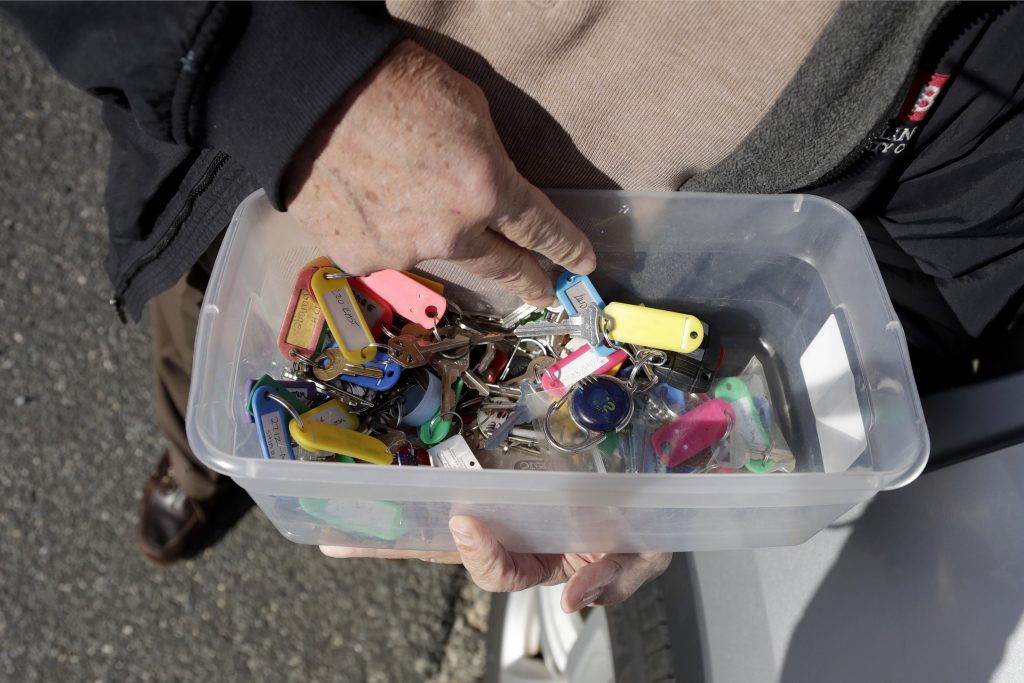 New Jersey Shore Tax Rentals In a photo taken Friday, Jan. 11, 2019, Vince Farias looks through a container with keys to his rental properties in Surf City, N.J. (Julio Cortez/AP Photo)