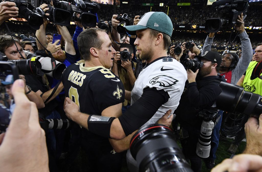 Eagles Saints Football New Orleans Saints quarterback Drew Brees (9) speaks with Philadelphia Eagles quarterback Nick Foles after an NFL divisional playoff football game in New Orleans, Sunday, Jan. 13, 2019. The Saints won 20-14 to advance to the NFC Championship. (AP Photo/Bill Feig)