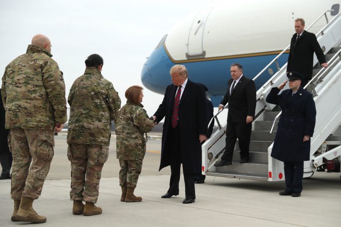 President Donald Trump greets Col. Dawn C. Lancaster, Commander Air Force Mortuary Affairs, at Dover Air Force Base, Del., Saturday, Jan. 19, 2019, as he arrives to pay tribute to the four Americans killed in a suicide bomb attack in Syria as their remains are returned as Chief Master Sgt. Danielle M. Hirvela, Chief Enlisted Manager, Air Force Mortuary Affairs Operations, second from left, and Chief Master Sgt. Anthony W. Green Command Chief Master Sergeant, 436th Airlift Wing, Dover Air Force Base, (left), watch. Following Trump are Secretary of State Mike Pompeo and acting Secretary of Defense Patrick Shanahan, (right). (Andrew Harnik/AP Photo)