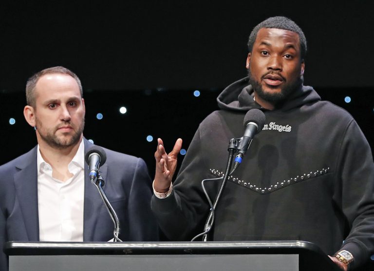 Recording artist Meek Mill, right, speaks about his incarceration along with Philadelphia 76ers co-owner and Fanatics executive chairman Michael Rubin at the launch of REFORM Alliance, a partnership among entertainment moguls, entrepreneurs, recording artists, and business and sports leaders who hope to transform the American criminal justice system, Wednesday, Jan. 23, 2019, in New York. (Kathy Willens/AP Photo)