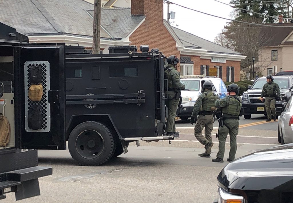 Police Standoff Shots Reported A police SWAT team arrives at the site of a standoff between law enforcement and a fugitive they were trying to arrest, Wednesday, Jan. 23, 2019 in Salem, N.J. New Jersey State Police and other law enforcement agencies responded to Salem after reports that shots were fired during the standoff. (Geoff Mulvihill/AP Photo)