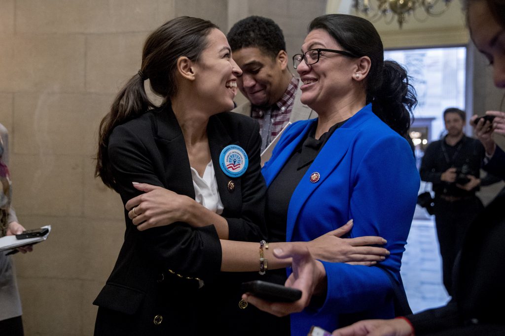 Alexandria Ocasio-Cortez, Rashida Tlaib In this Jan. 16, 2019, photo, Rep. Alexandria Ocasio-Cortez, D-N.Y., left, and Rep. Rashida Tlaib, D-Mich., right, laugh as they wait for other freshman Congressmen to deliver a letter calling to an end to the government shutdown to deliver to the office of Senate Majority Leader Mitch McConnell of Ky., on Capitol Hill in Washington. It's known as