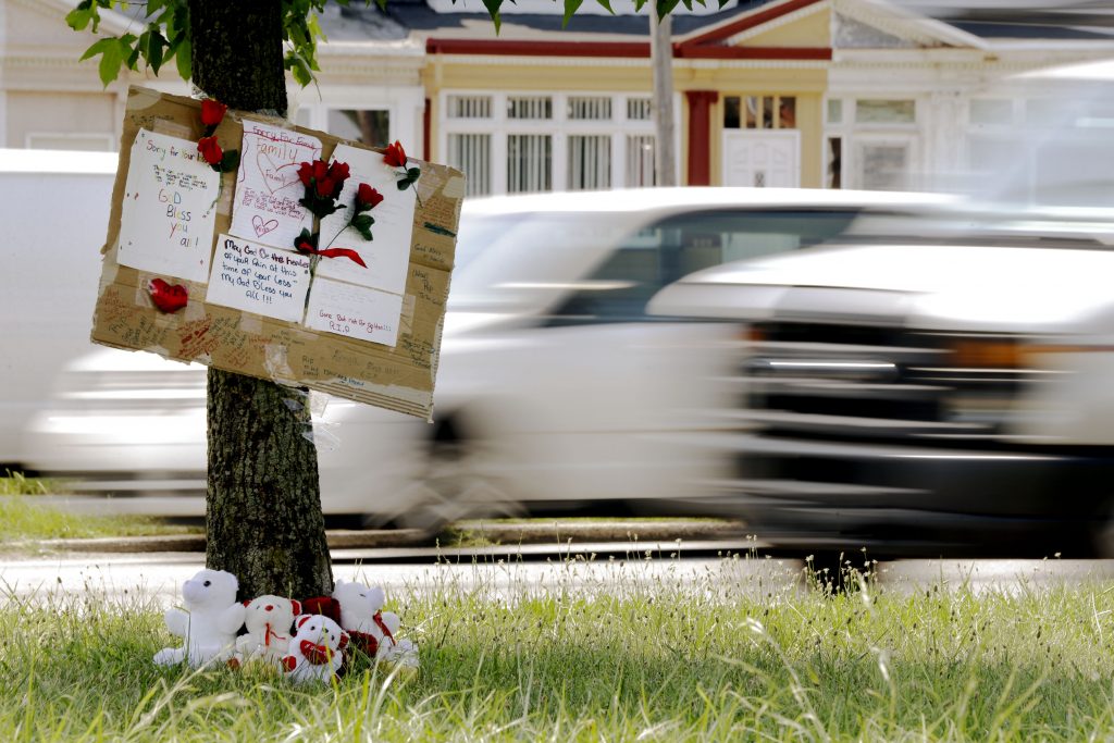 Family Struck on Highway A makeshift memorial is shown near the location where a mother and three young sons were struck and killed while trying to cross a busy highway after dark, Wednesday, July 17, 2013, in Philadelphia. (Matt Rourke/AP Photo)