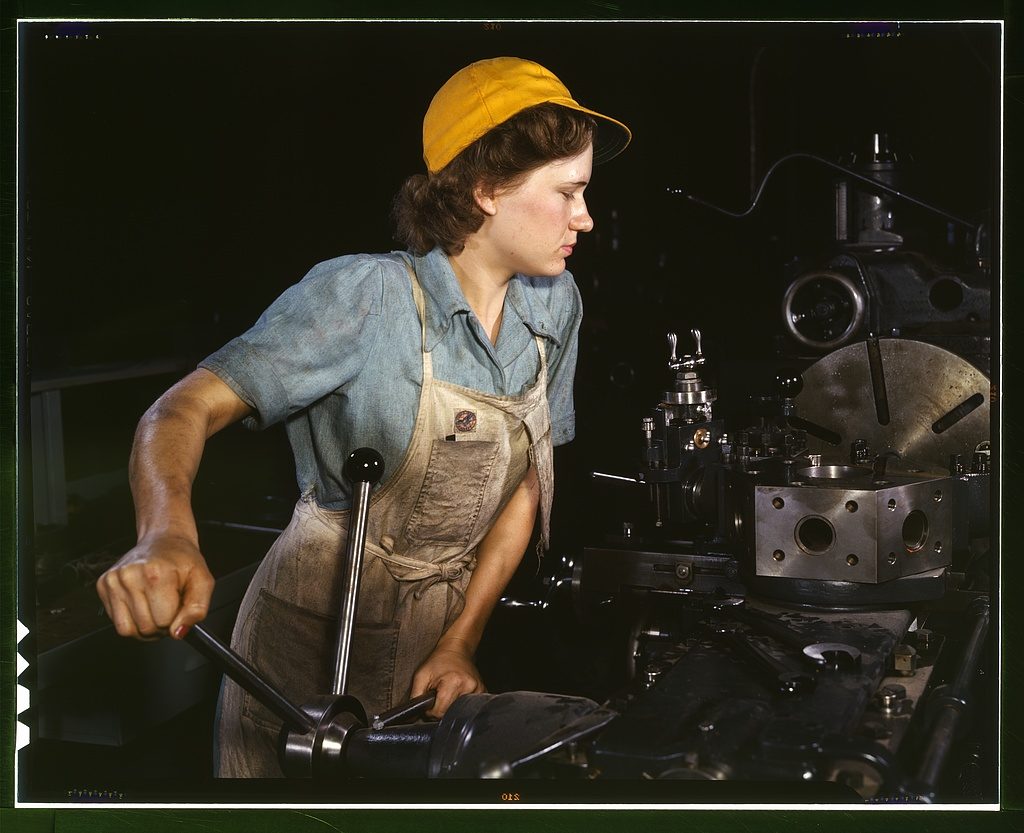 Factory girl A lathe operator machining parts for transport planes at the Consolidated Aircraft Corporation plant, Fort Worth, Texas 1942