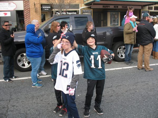 Nick Foles (background left), Tom Brady, and Carson Wentz remember the Super Bowl in the form of George, Katlyn, and Kyle Barbera of Townsend. (John Mussoni/WHYY)