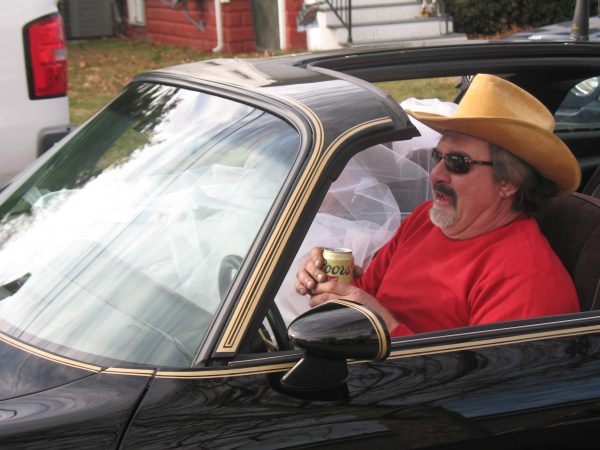 There were two nods to Burt Reynolds who passed away in 2018. This look-alike lives in the Dutch Neck farms development in Middletown. (John Mussoni/WHYY)