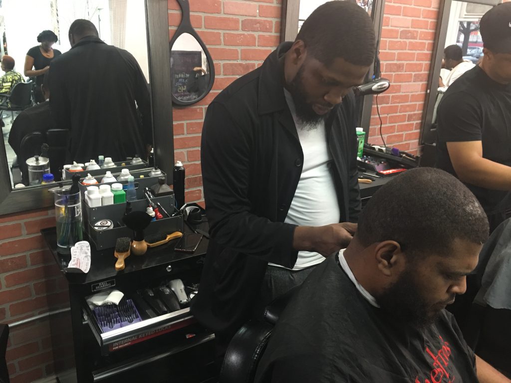 IMG_1357 Philly-based barber B. Jawuan Jones wanted to give back to the community by giving free haircuts to homeless people. In 2017, he was gifted his own barber shop. Over the next five years, Jones hopes to open a homeless shelter. (Taylor Allen/WHYY News)