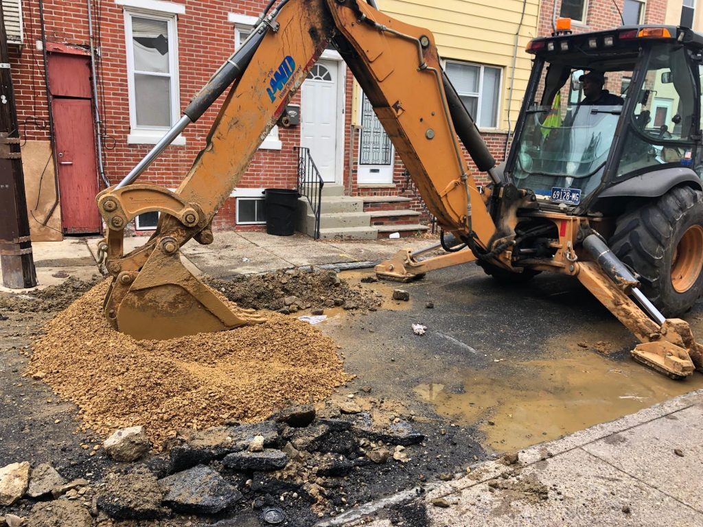 IMG_2375 A Philadelphia Water Department crew completed the fix of a water main break in South Philadelphia as the department steps up efforts to manage water main breaks during the winter. (Darryl Murphy/WHYY)