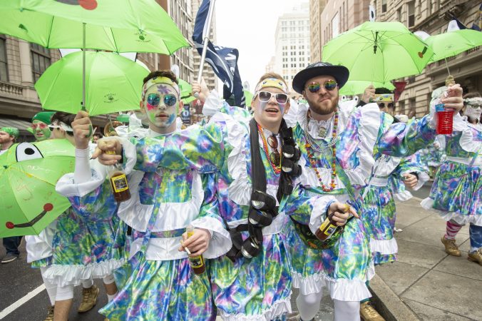Members of the Wench Division's Froggy Carr entertain the crowd as they wait for judging and the march down Broad St. (Jonathan Wilson for WHYY)