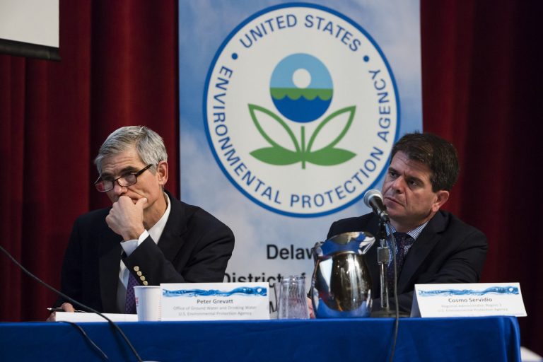 In this July 25, 2018 photo US EPAs Peter Grevatt, Director of the Office of Ground Water and Drinking Water and Cosmo Servidio, Regional Administrator for the Mid-Atlantic Region, listen to members of the public comment during a PFAS Community Stakeholder Meeting, on in Horsham, Pa. In Horsham and surrounding towns in eastern Pennsylvania, and at other sites around the United States, the foams once used routinely in firefighting training at military bases contained per-and polyfluoroalkyl substances, or PFAS. EPA testing between 2013 and 2015 found significant amounts of PFAS in public water supplies in 33 U.S. states. (AP Photo/Matt Rourke)