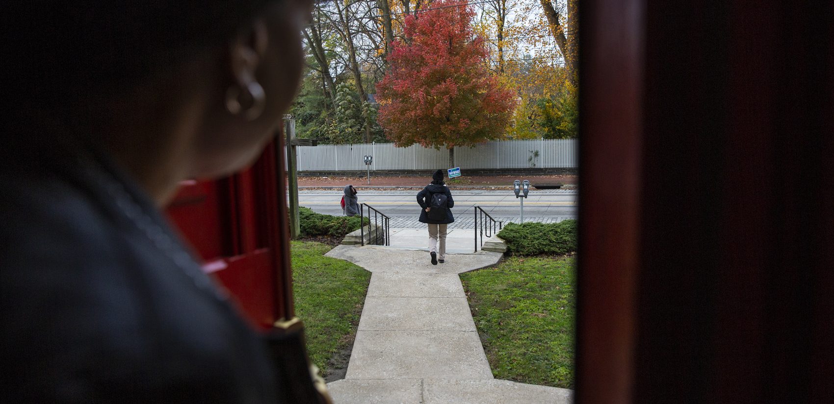 Oneita Thompson watches from the door of the First United Methodist Church of Germantown as her daughter Christine, who is 16, leaves for school on Monday, Nov. 12, 2018. (Heather Khalifa/The Philadelphia Inquirer)
