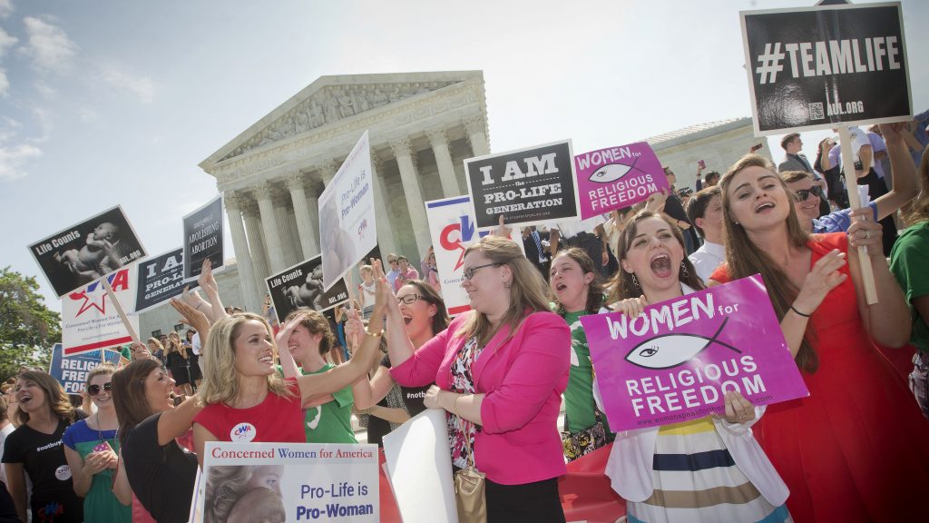 In this 2014 photo, demonstrators react to hearing the Supreme Court’s decision on the Hobby Lobby birth control case outside the Supreme Court in Washington. A judge in California has blocked implementation of a Trump administration policy that would let more employers decline to offer birth control coverage on religious or moral grounds. In this 2014 photo, demonstrators react to hearing the Supreme Court's decision on the Hobby Lobby birth control case outside the Supreme Court in Washington. A judge in California has blocked implementation of a Trump administration policy that would let more employers decline to offer birth control coverage on religious or moral grounds.