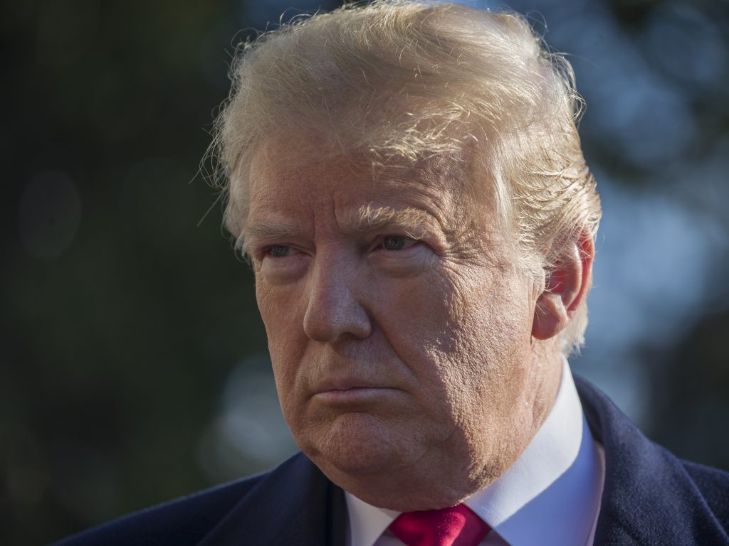 President Donald Trump tells reporters on the South Lawn of the White House that the U.S. will not withdraw its troops from Syria until the Islamic State has been defeated. (Alex Brandon/AP)
