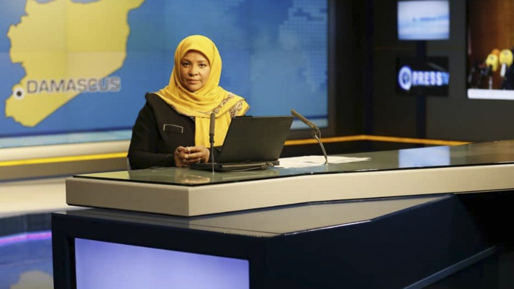 American-born news anchor Marzieh Hashemi sits in a studio in Tehran where she works for Iran’s state television. She was arrested Sunday during a visit to the U.S., her family says. She is testifying behind closed doors to a grand jury in Washington, D.C., in an unspecified case, a U.S. judge said Friday. American-born news anchor Marzieh Hashemi sits in a studio in Tehran where she works for Iran's state television. She was arrested Sunday during a visit to the U.S., her family says. She is testifying behind closed doors to a grand jury in Washington, D.C., in an unspecified case, a U.S. judge said Friday. (Press TV/AP)