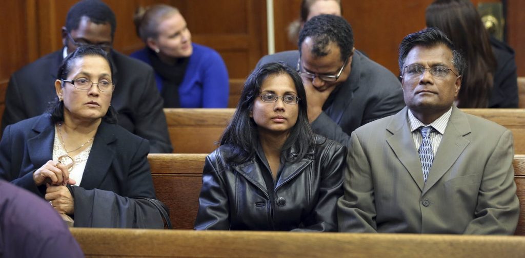 file-20190123-135154-1o5cowh Annie Dookhan, (center), pictured with her family in a Boston courtroom Nov. 22, 2013, after she pleaded guilty to tampering with evidence. Dookhan was a state chemist. (David L. Ryan/AP/The Boston Globe)