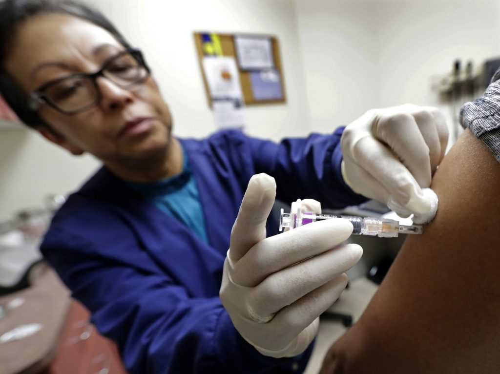 flu_shot_jan19-1920×1436 Ana Martinez gives a patient a flu shot