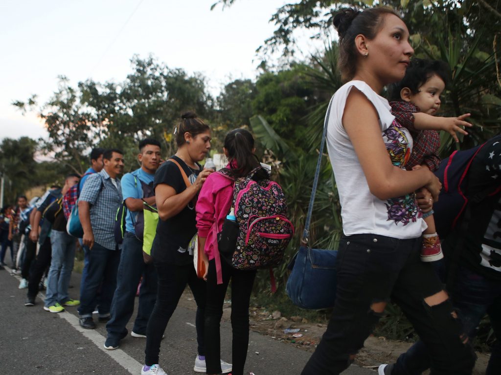 Honduran migrants wait in line to cross over the border checkpoint into Guatemala in Agua Caliente, Honduras. A new caravan of at least several hundred Hondurans has set off toward the United States on foot or in vehicles. Some have already crossed into Guatemala. Honduran migrants wait in line to cross over the border checkpoint into Guatemala in Agua Caliente, Honduras. A new caravan of at least several hundred Hondurans has set off toward the United States on foot or in vehicles. Some have already crossed into Guatemala. (Mario Tama/Getty Images)
