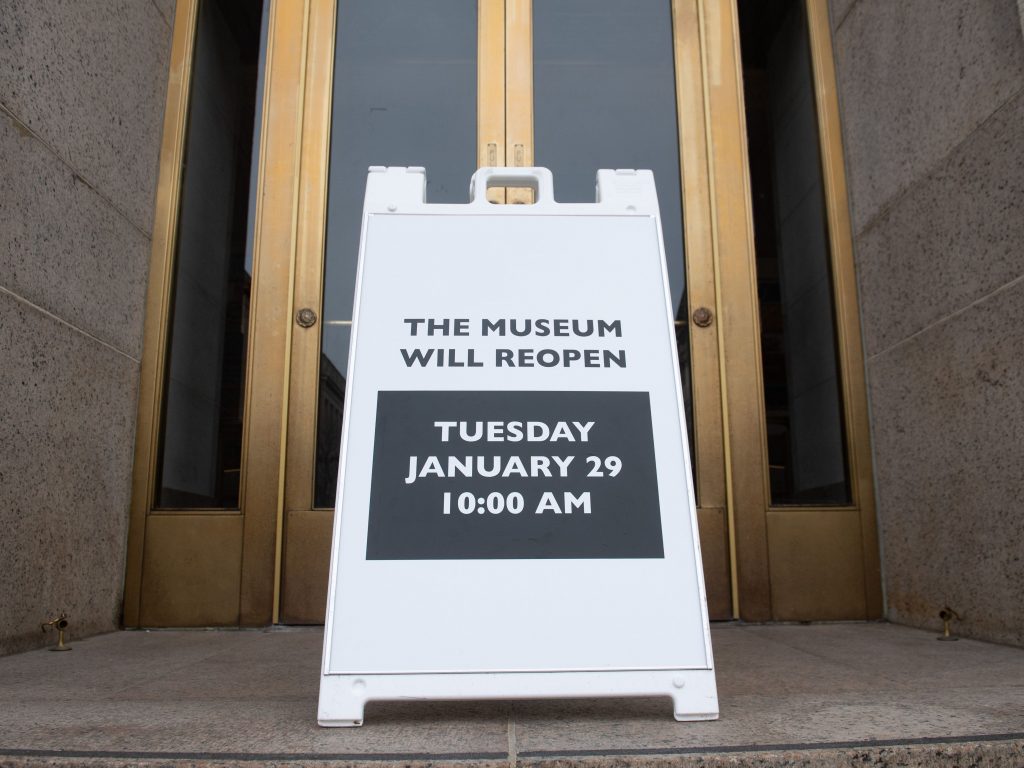 A sign at the entrance of the Smithsonian National Museum of Natural History in Washington, D.C., says the museum will reopen Tuesday. The shutdown reduced federal spending by $18 billion, although most of that will be recouped now that the government has reopened, according to a new report. A sign at the entrance of the Smithsonian National Museum of Natural History in Washington, D.C., says the museum will reopen Tuesday. The shutdown reduced federal spending by $18 billion, although most of that will be recouped now that the government has reopened, according to a new report.
(Saul Loeb/AFP/Getty Images)