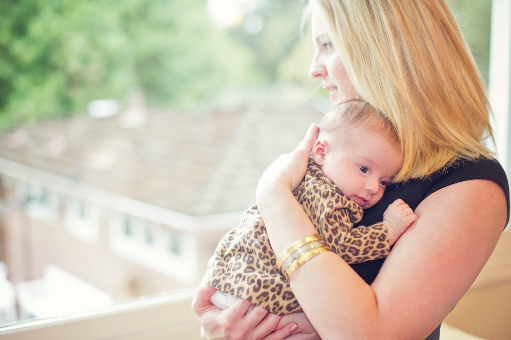 Lisa Abramson and her firstborn child, Lucy, in 2014. A few weeks after Lucy's birth, Abramson started feeling confused, and then started developing delusions — symptoms of postpartum psychosis. (Courtesy of Claire Mulkey)