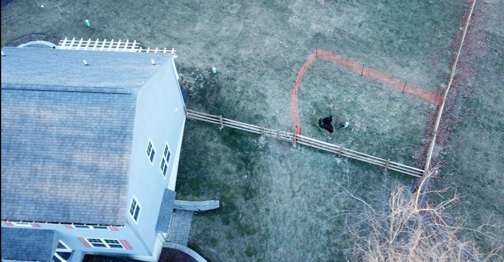 lisa_drive_drone_shot-e1548435221150-1920×998 A new sinkhole that opened up on Sunday was surrounded by orange plastic fencing outside a suburban home at Lisa Drive in West Whiteland Township, Chester County.
(Eric Friedman/Provided)