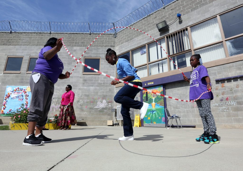 Mothers Day Inmates Taryn Mitchell playing with her daughter at Folsom Women's Facility in Folsom Calif. (AP Photo/Rich Pedroncelli)