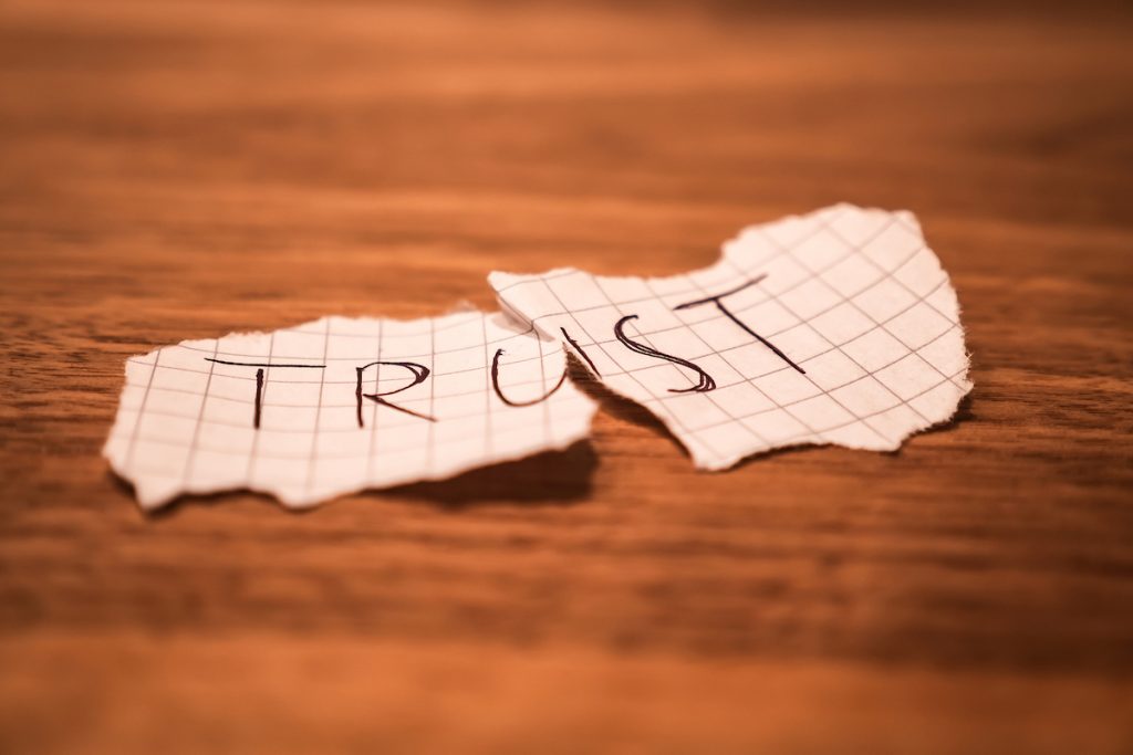 No Trust Handwritten Teared Up Peace Of Paper On A Table After Cheating