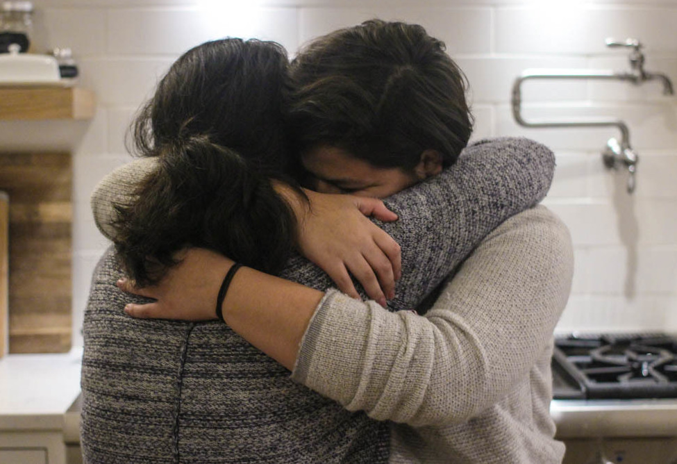 Maria Rivas and her 15-year-old daughter, Emily, embrace after their StoryCorps interview last month. Maria Rivas and her 15-year-old daughter, Emily, embrace after their StoryCorps interview last month. (Mia Warren/StoryCorps)